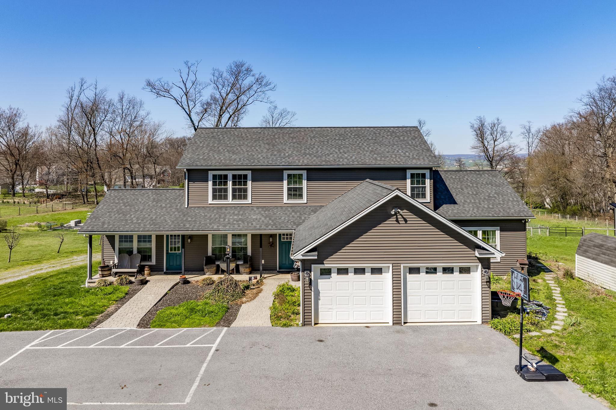 744 Lime Quarry Road Gap, PA 17527 - Photo 11 of 76 a view of house with a yard and potted plants