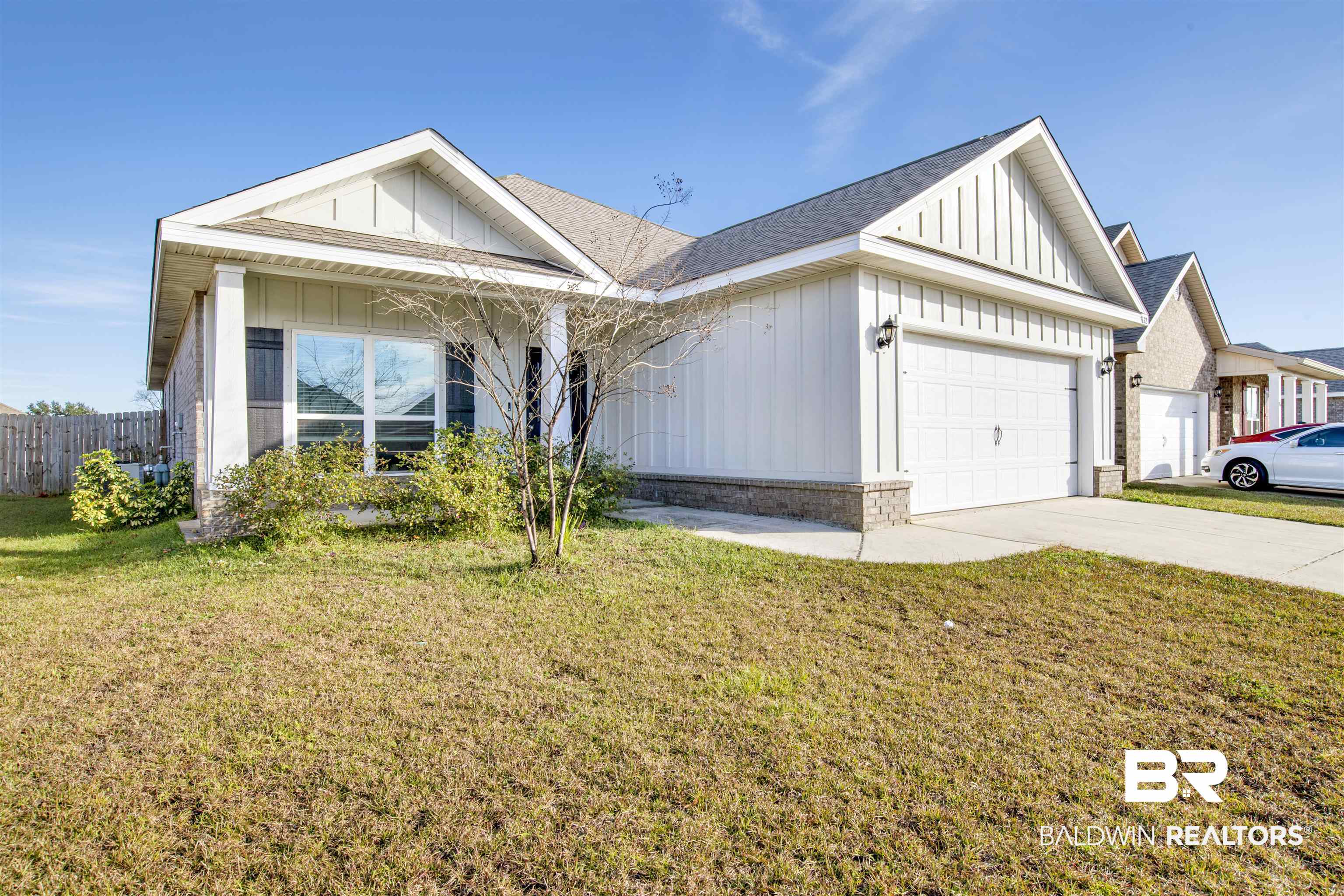 9622 Volterra Avenue Daphne, AL 36526 - Photo 1 of 31 Ranch-style house with a garage and a front lawn