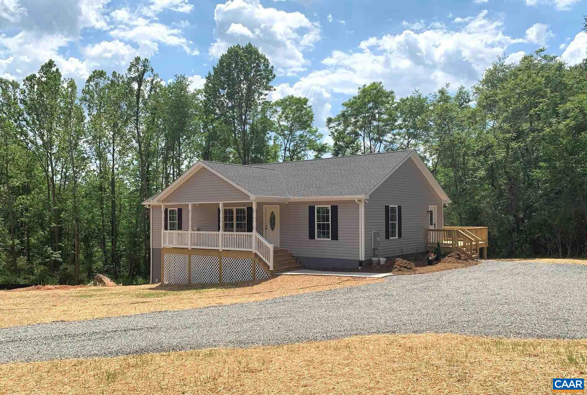 a house with trees in the background