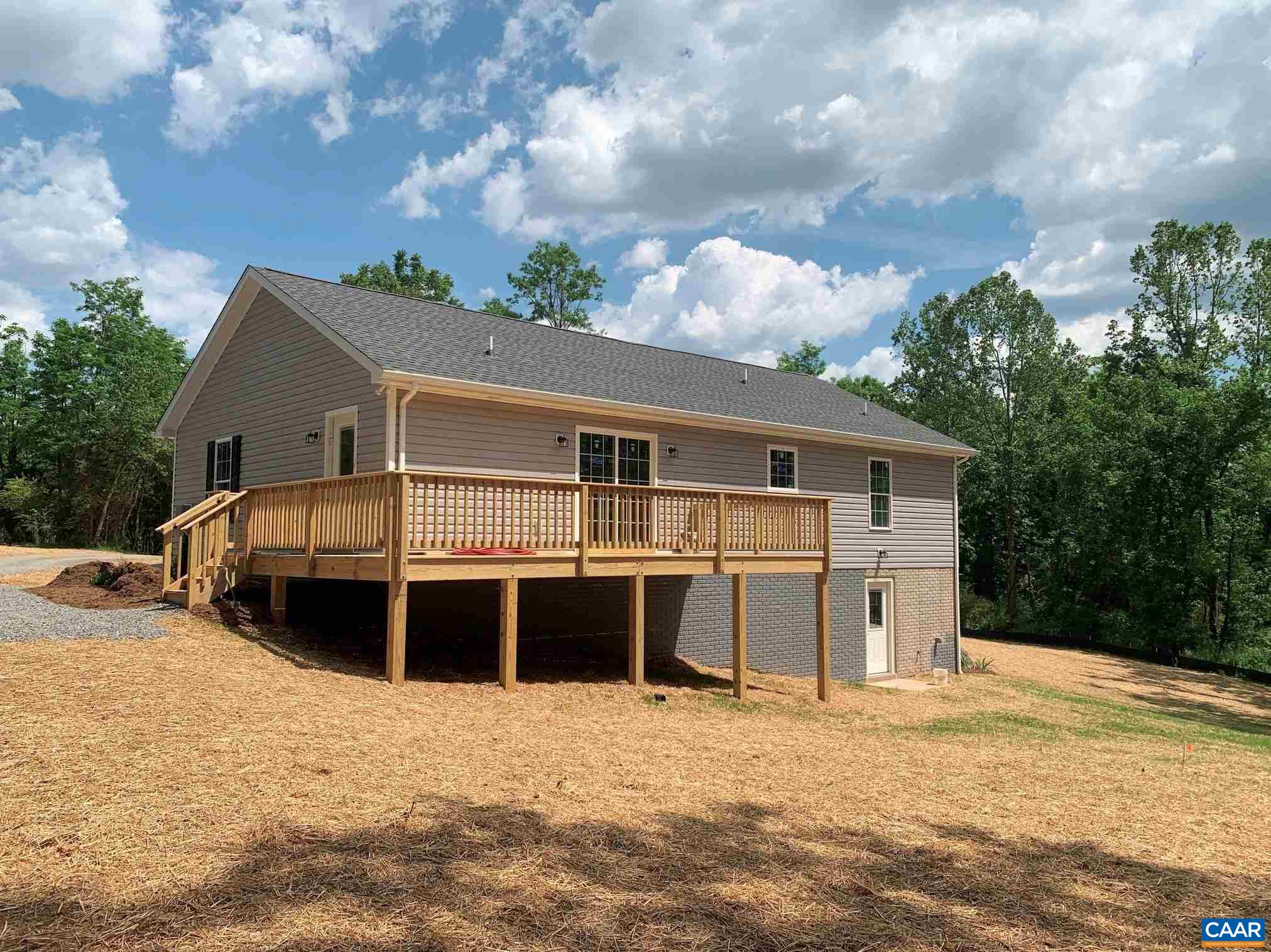379 Carpenters Mill Road Pratts, VA 22731 - Photo 4 of 20 a front view of a house with a garden and deck