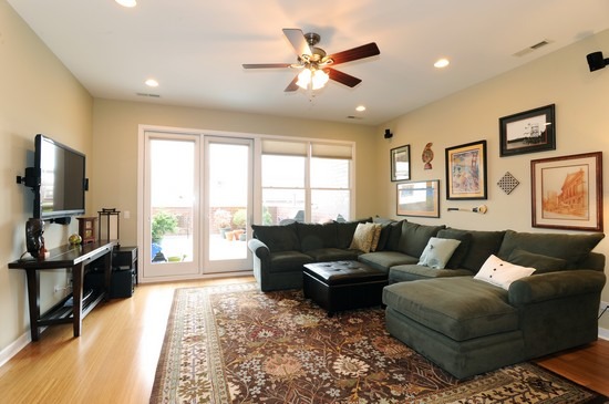 1842 West Irving Park Road, Unit 201 Chicago, IL 60613 - Photo 2 of 13 a living room with furniture flat screen tv and a large window