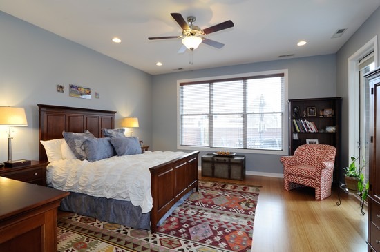 1842 West Irving Park Road, Unit 201 Chicago, IL 60613 - Photo 7 of 13 a bedroom with a bed furniture and a window