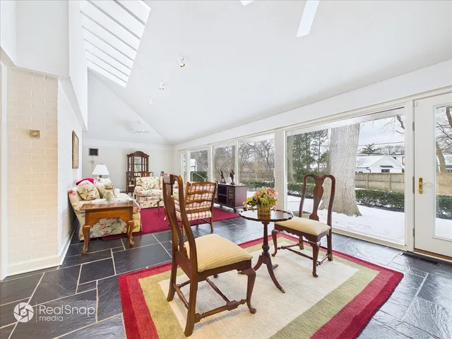 a living room with furniture and a rug