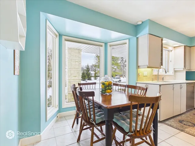 a view of a dining room with furniture window and outside view