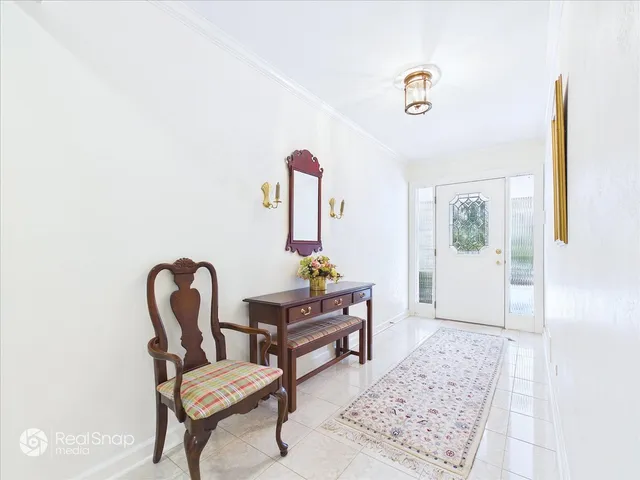 a living room with furniture and a piano