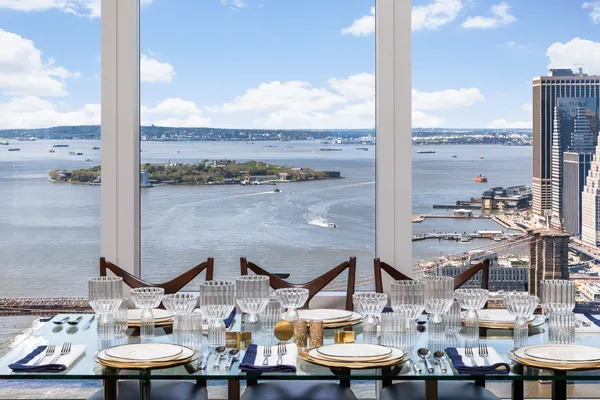 a picture of a bench in front of a wall