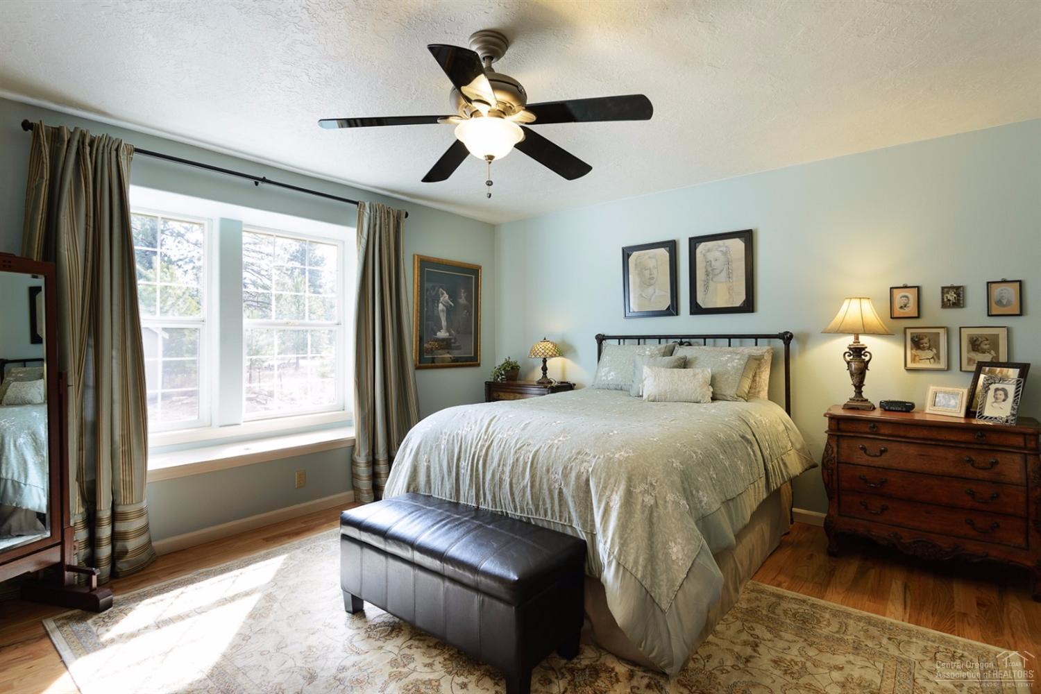 60030 Navajo Road Bend, OR 97702 - Photo 10 of 20 a bedroom with a bed and a large window