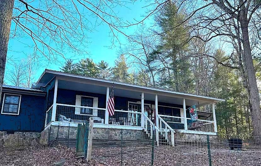 1522 Turkey Creek Road Tellico Plains, TN 37385 - Photo 1 of 34 a view of house with a yard and large tree