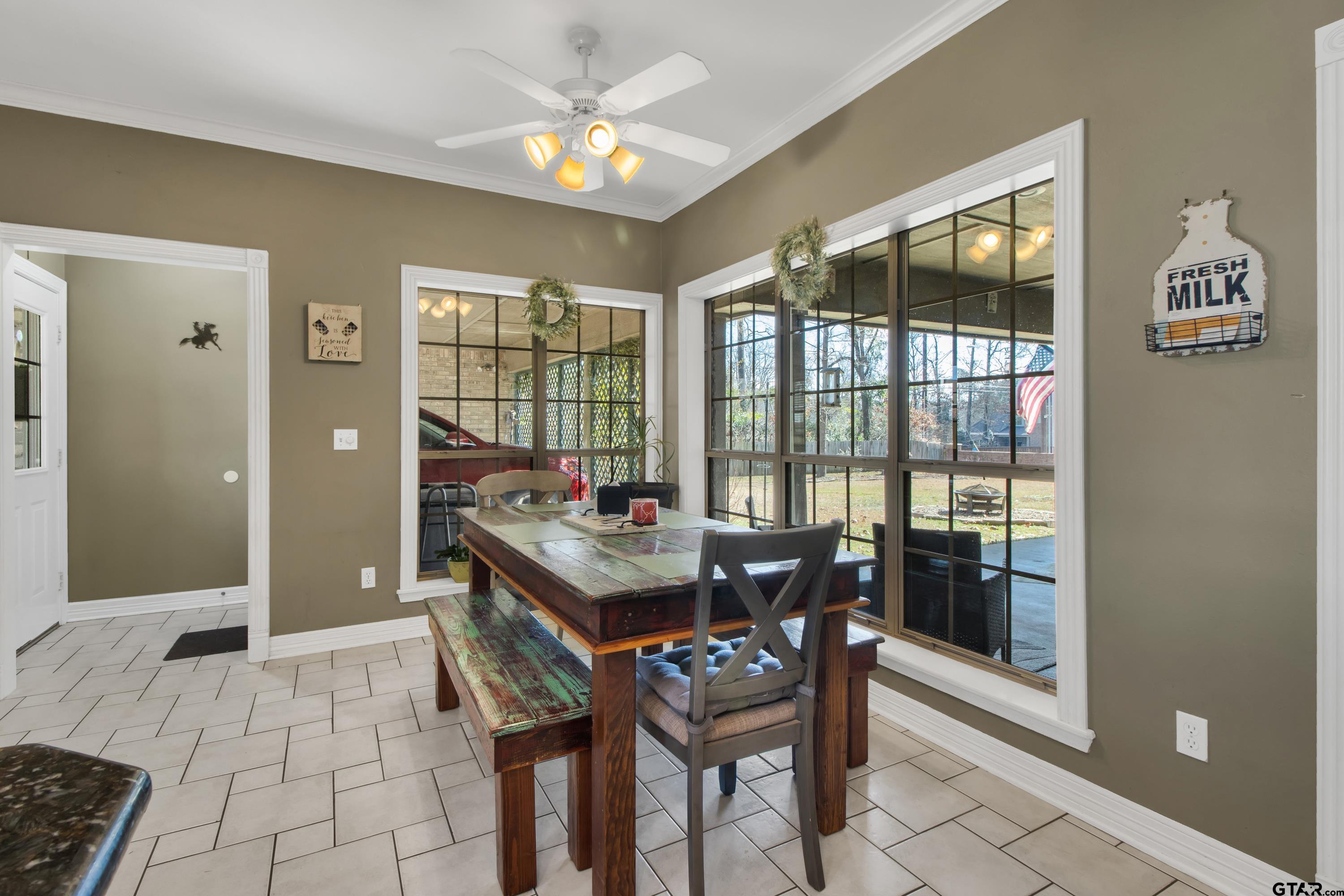 3800 Holly Ridge Drive Longview, TX 75605 - Photo 13 of 38 a view of a dining room with furniture a chandelier and wooden floor