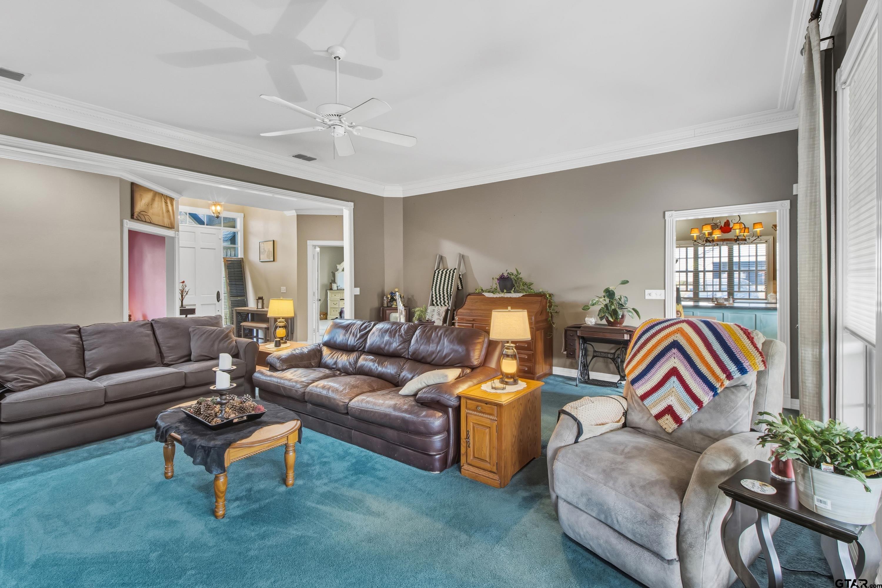 3800 Holly Ridge Drive Longview, TX 75605 - Photo 16 of 38 a living room with furniture ceiling fan and a rug
