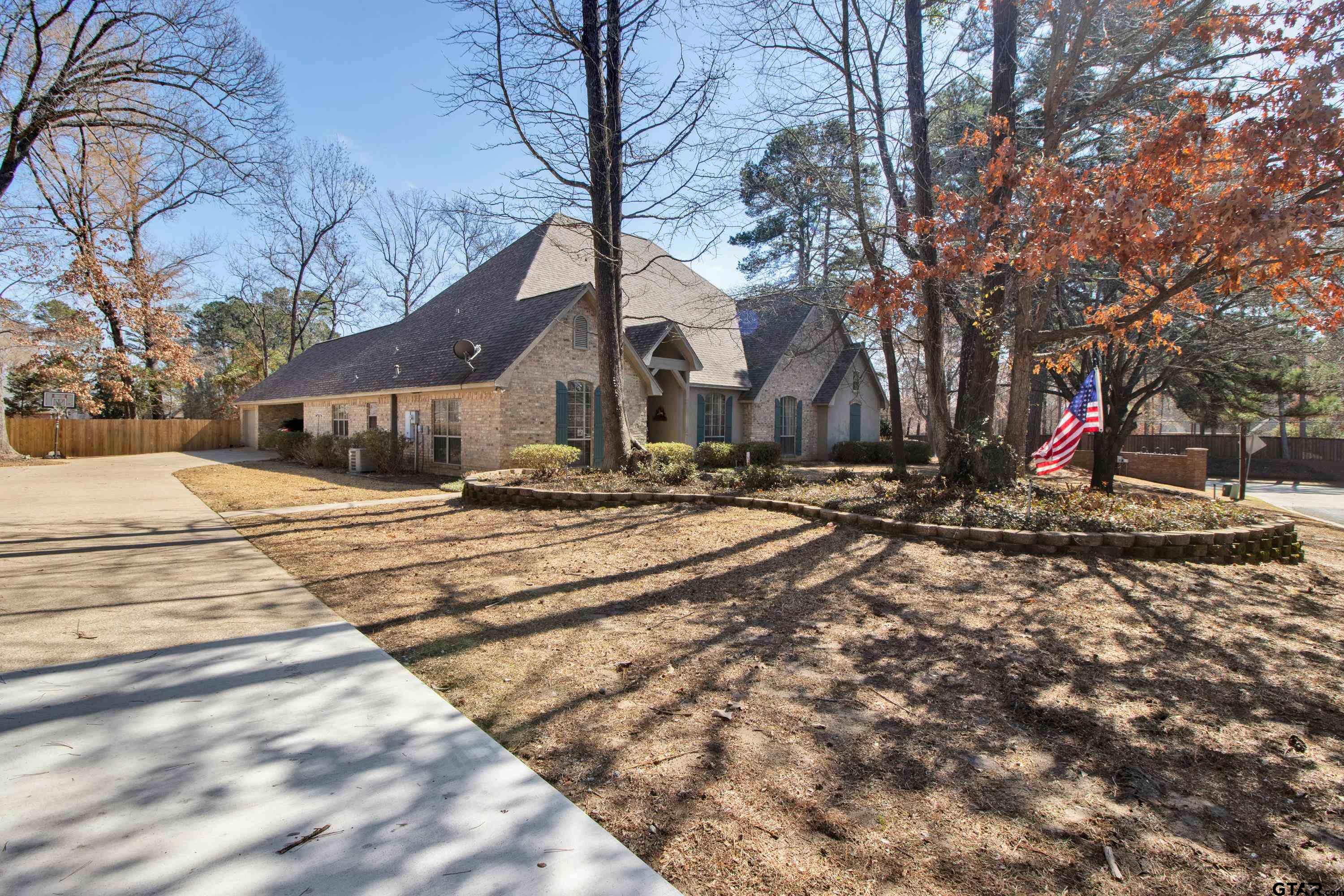 3800 Holly Ridge Drive Longview, TX 75605 - Photo 2 of 38 a view of road with house and trees