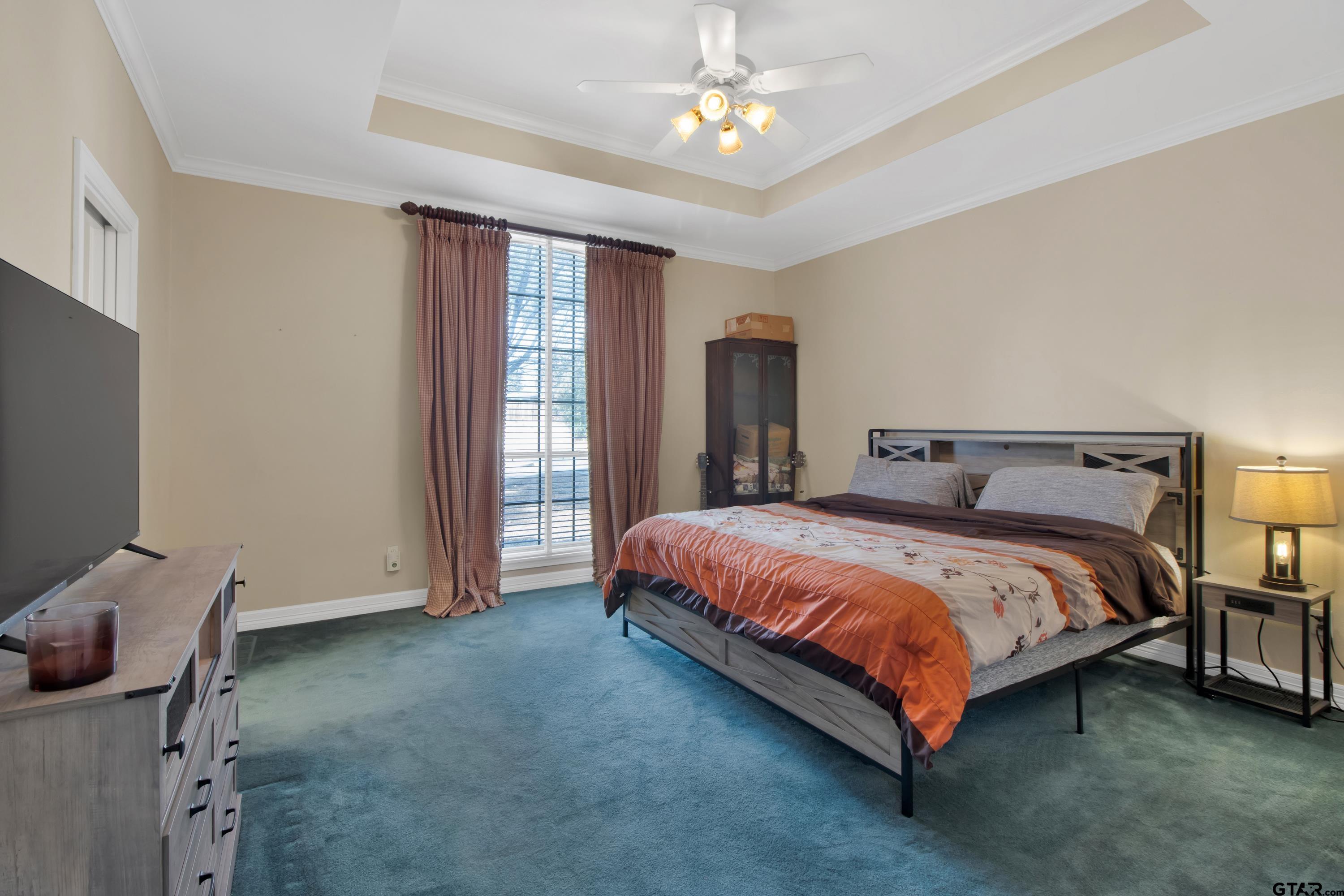 3800 Holly Ridge Drive Longview, TX 75605 - Photo 23 of 38 a bed sitting in a spacious bedroom next to a window