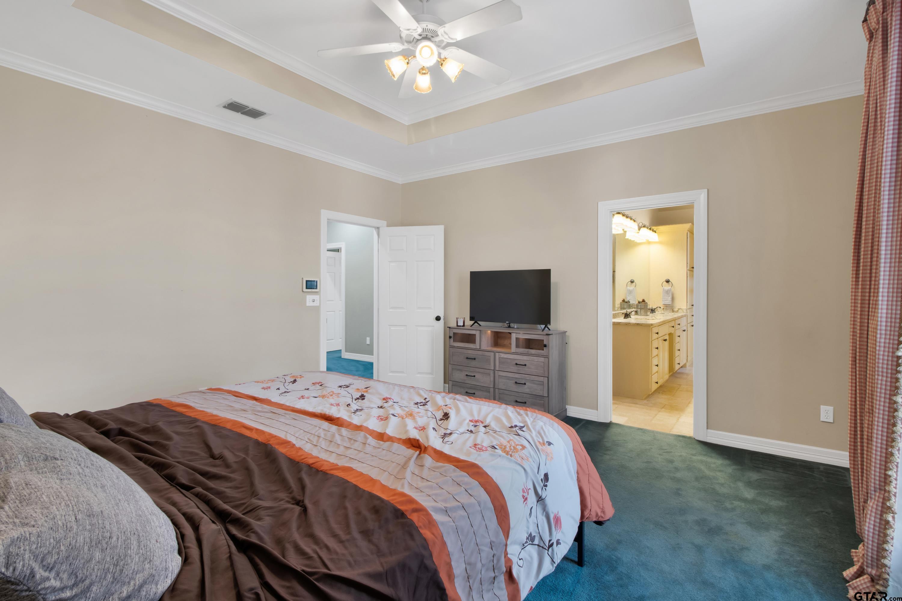 3800 Holly Ridge Drive Longview, TX 75605 - Photo 24 of 38 a bedroom with a bed and a tv