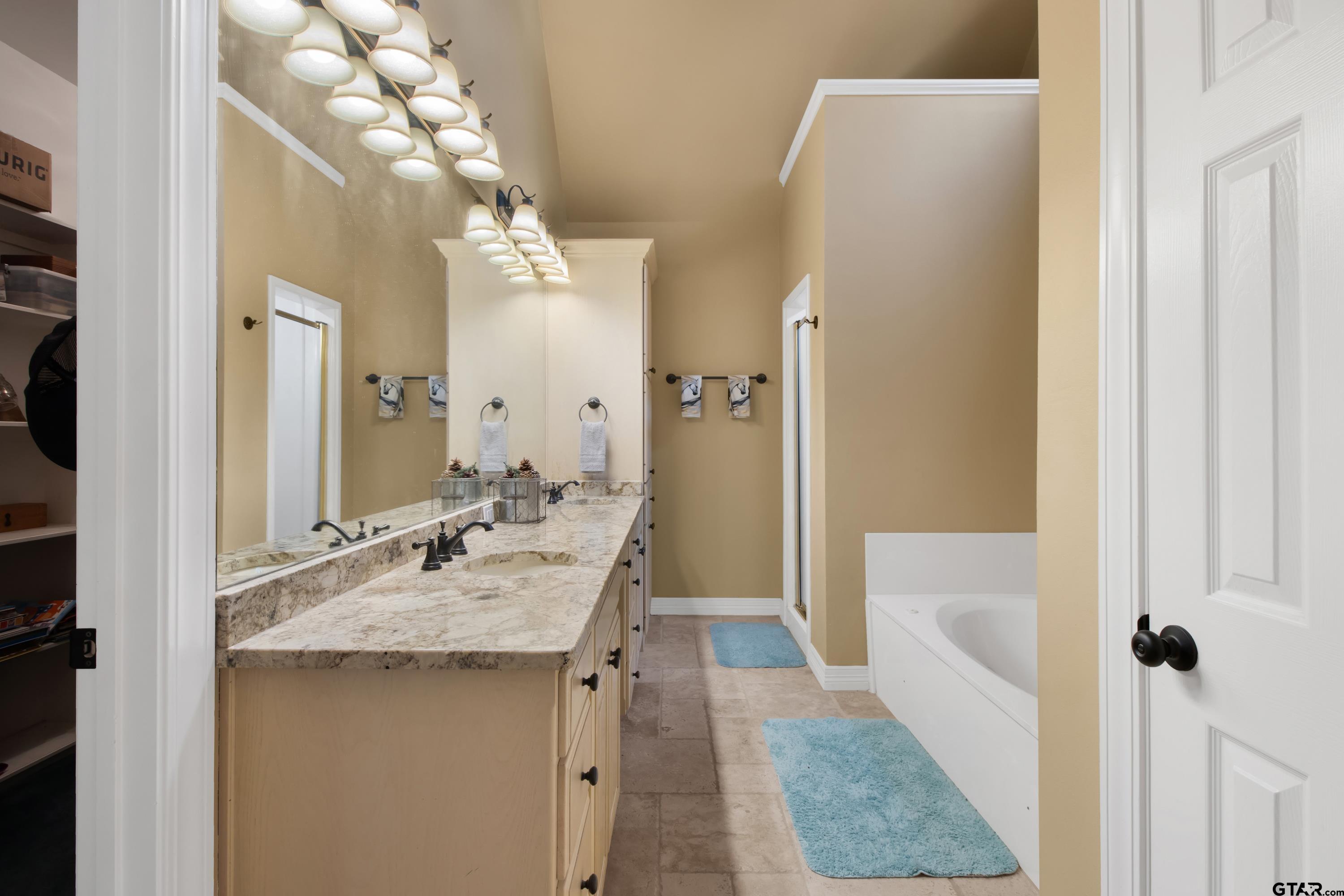3800 Holly Ridge Drive Longview, TX 75605 - Photo 25 of 38 a bathroom with a sink vanity granite tub and shower