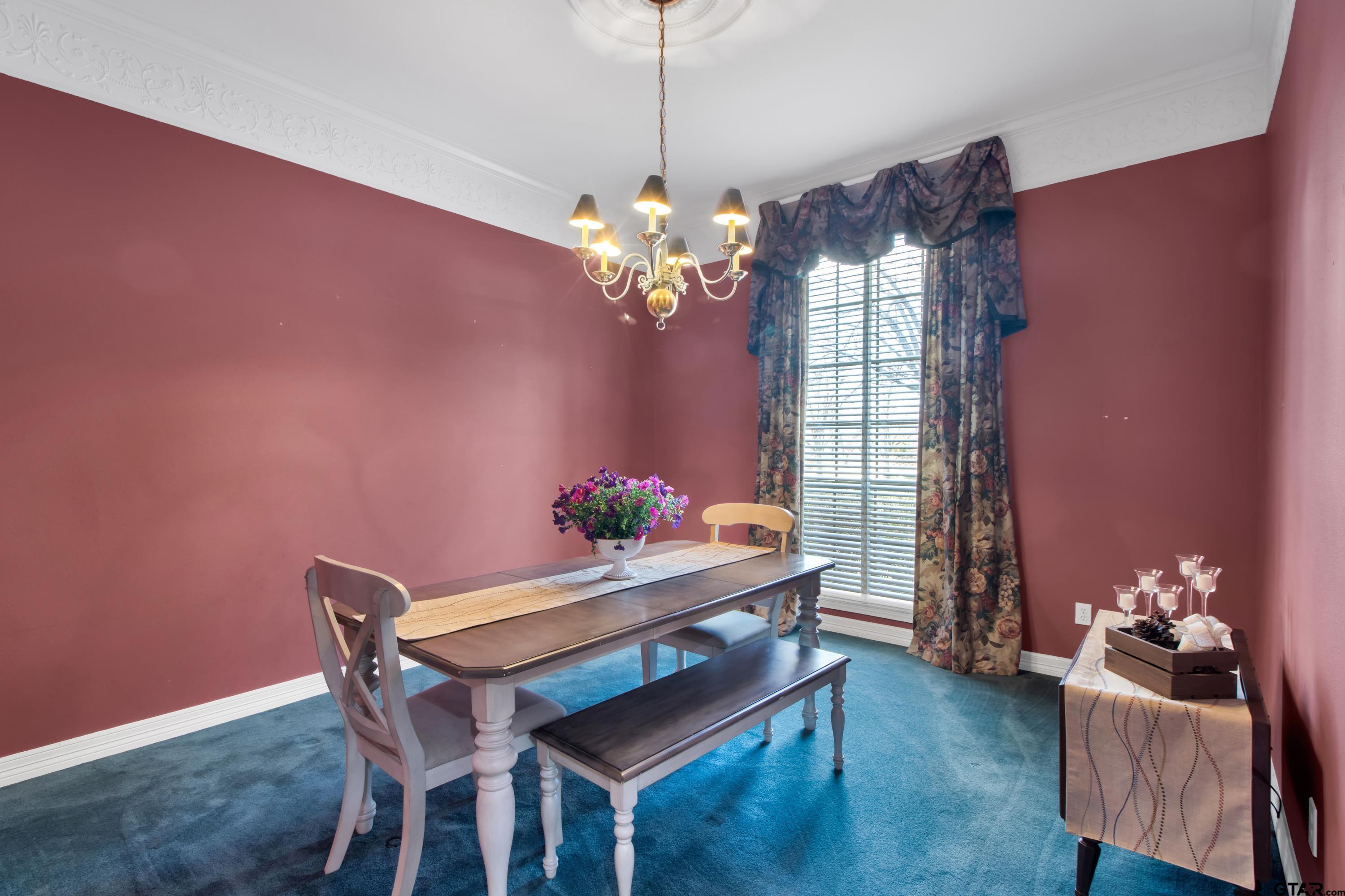 3800 Holly Ridge Drive Longview, TX 75605 - Photo 7 of 38 a dining room with furniture and chandelier