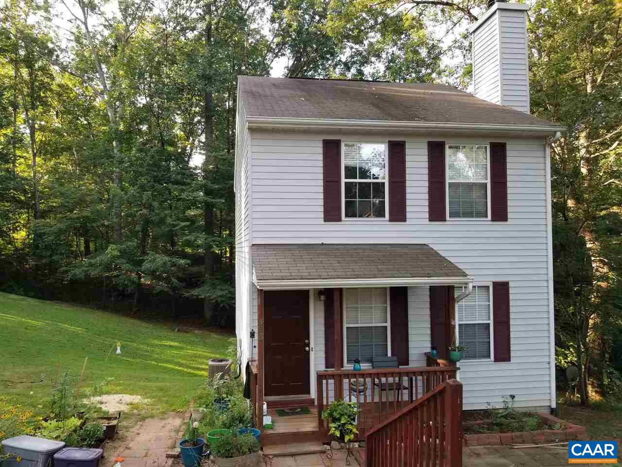 403 Jonquil Road Ruckersville, VA 22968 - Photo 2 of 2 a view of a house with brick walls and a yard with plants