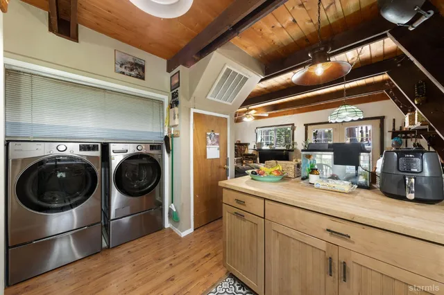 a view of a hallway with washer and dryer