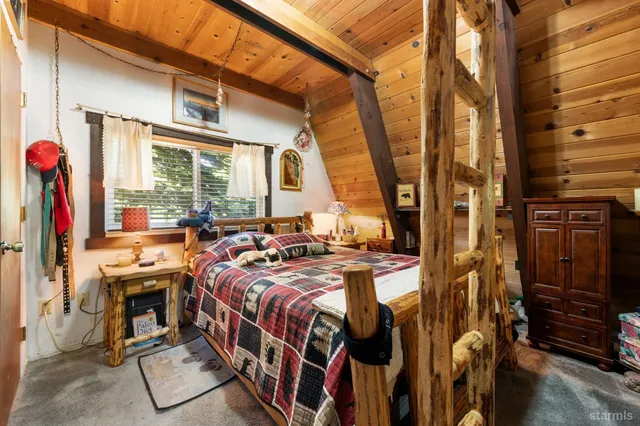 a bed room with a bed and a balcony