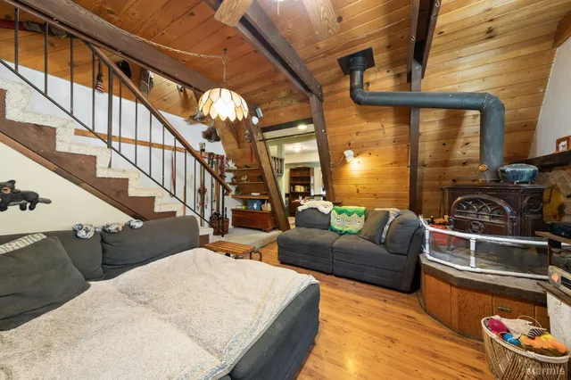 a living room with furniture fireplace and a rug