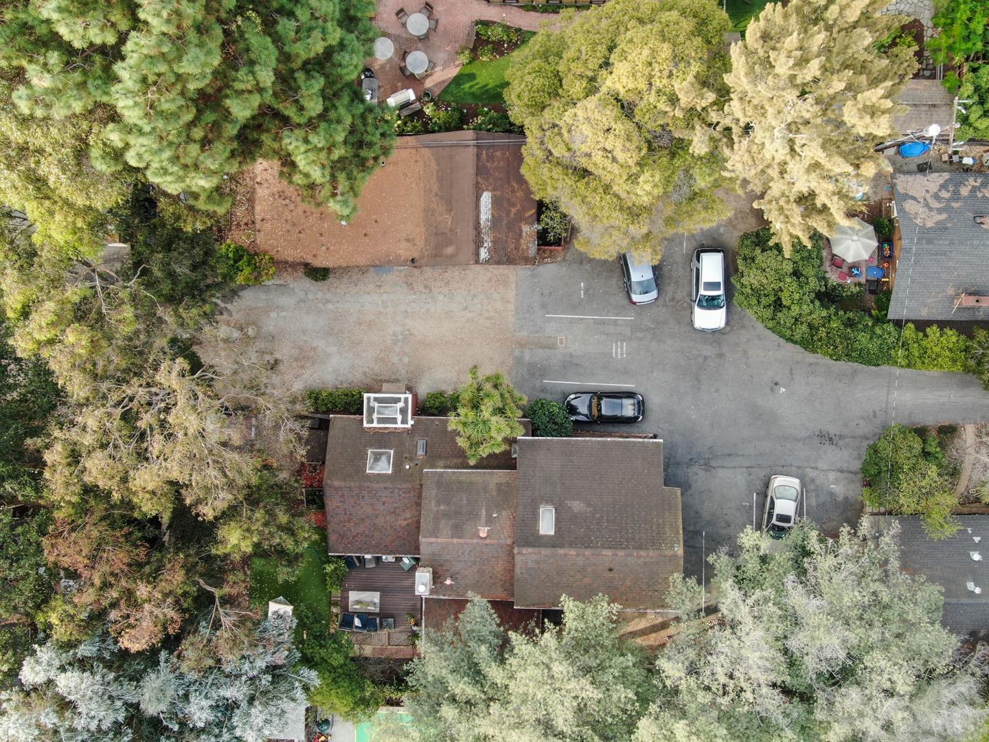 an aerial view of a house with outdoor space and street view