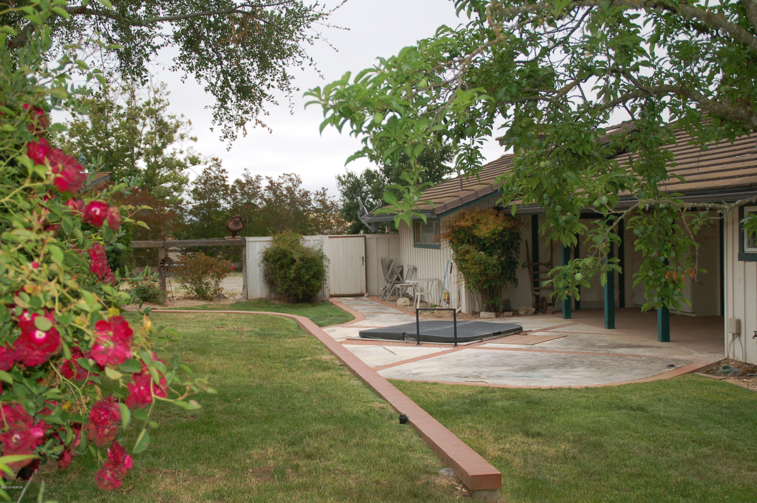 724 North Refugio Road Santa Ynez, CA 93460 - Photo 14 of 25 a front view of a house with a tree
