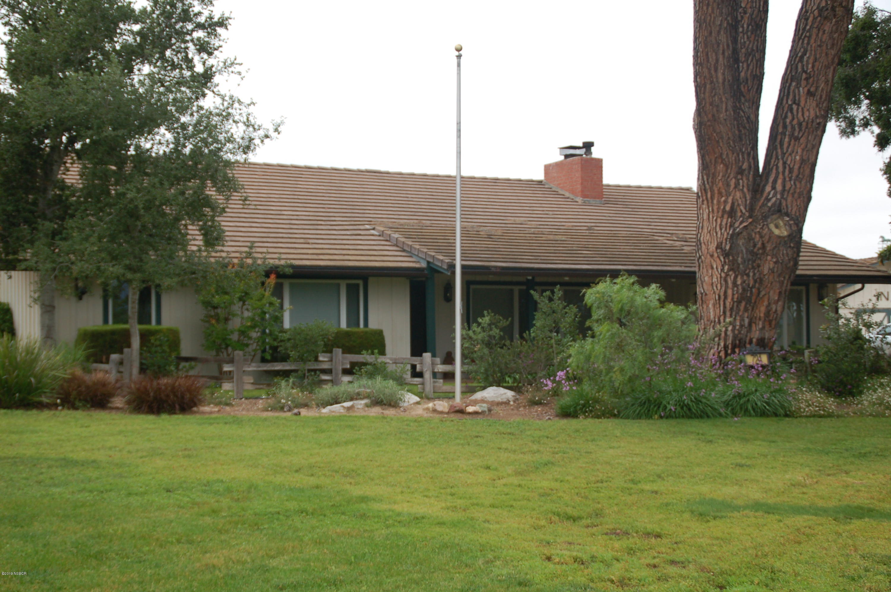 724 North Refugio Road Santa Ynez, CA 93460 - Photo 2 of 25 a view of a house with backyard and sitting area