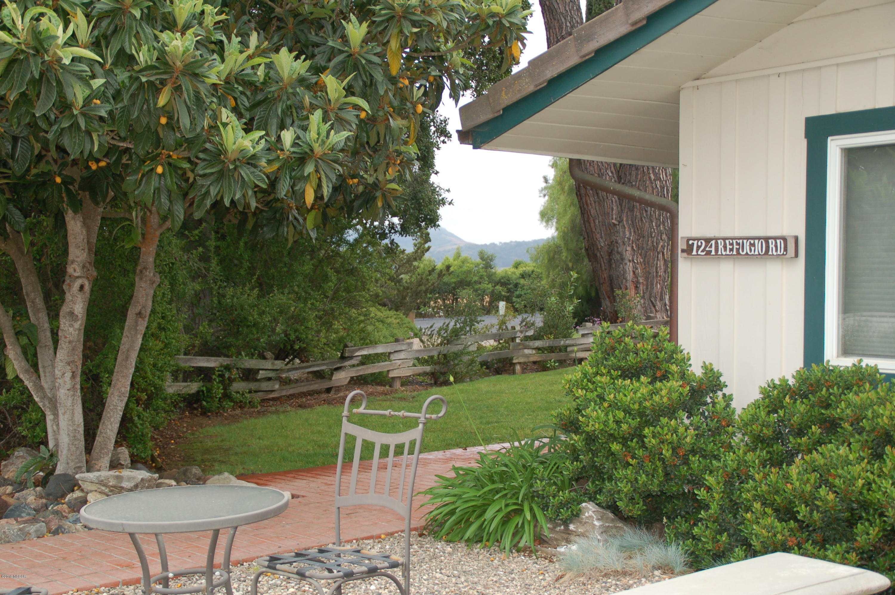 724 North Refugio Road Santa Ynez, CA 93460 - Photo 24 of 25 a view of a chair and table in the garden