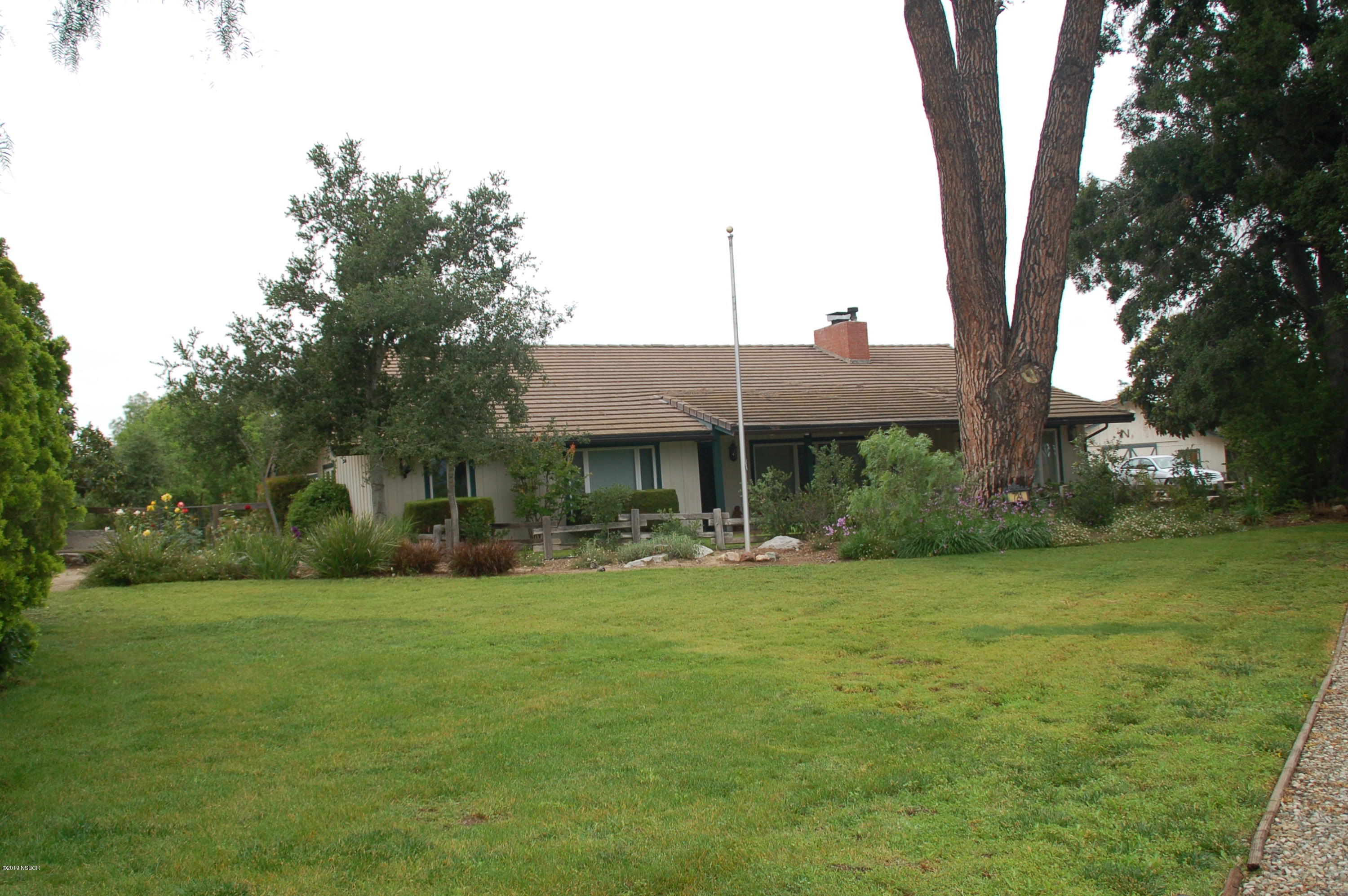 724 North Refugio Road Santa Ynez, CA 93460 - Photo 25 of 25 a front view of house with yard and trees