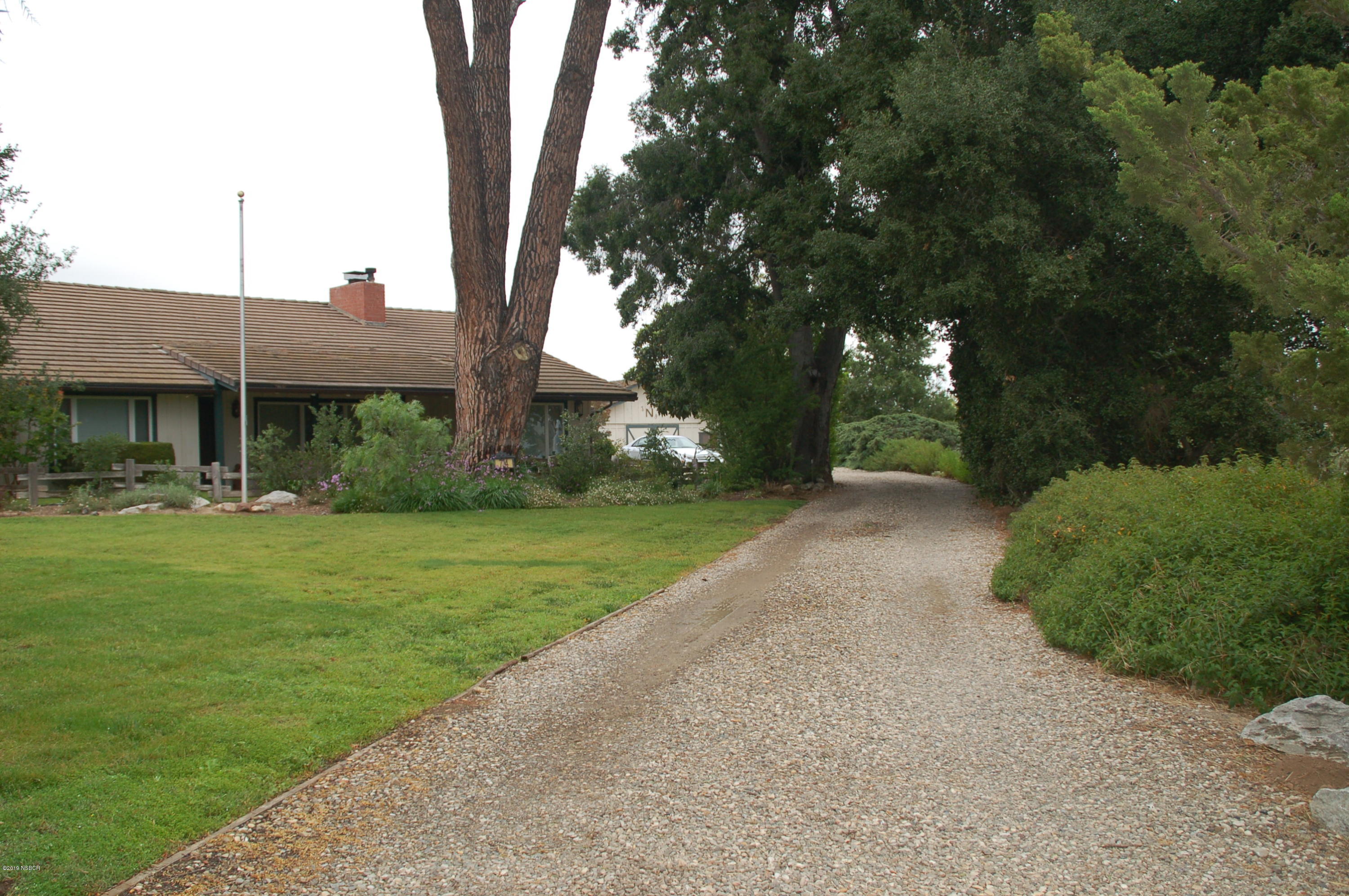 724 North Refugio Road Santa Ynez, CA 93460 - Photo 3 of 25 a front view of a house with garden