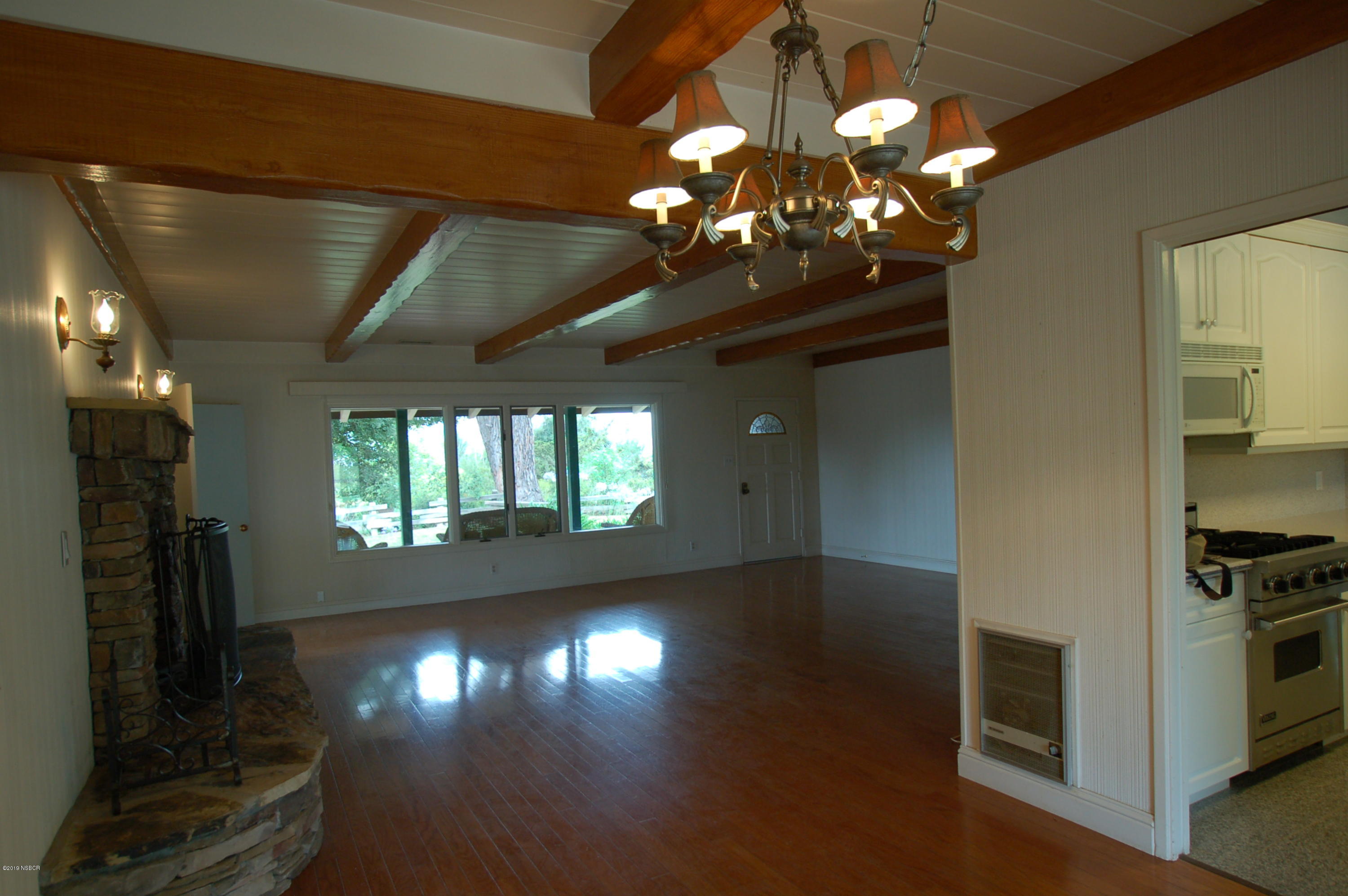 724 North Refugio Road Santa Ynez, CA 93460 - Photo 4 of 25 a view of a livingroom with furniture wooden floor and chandelier