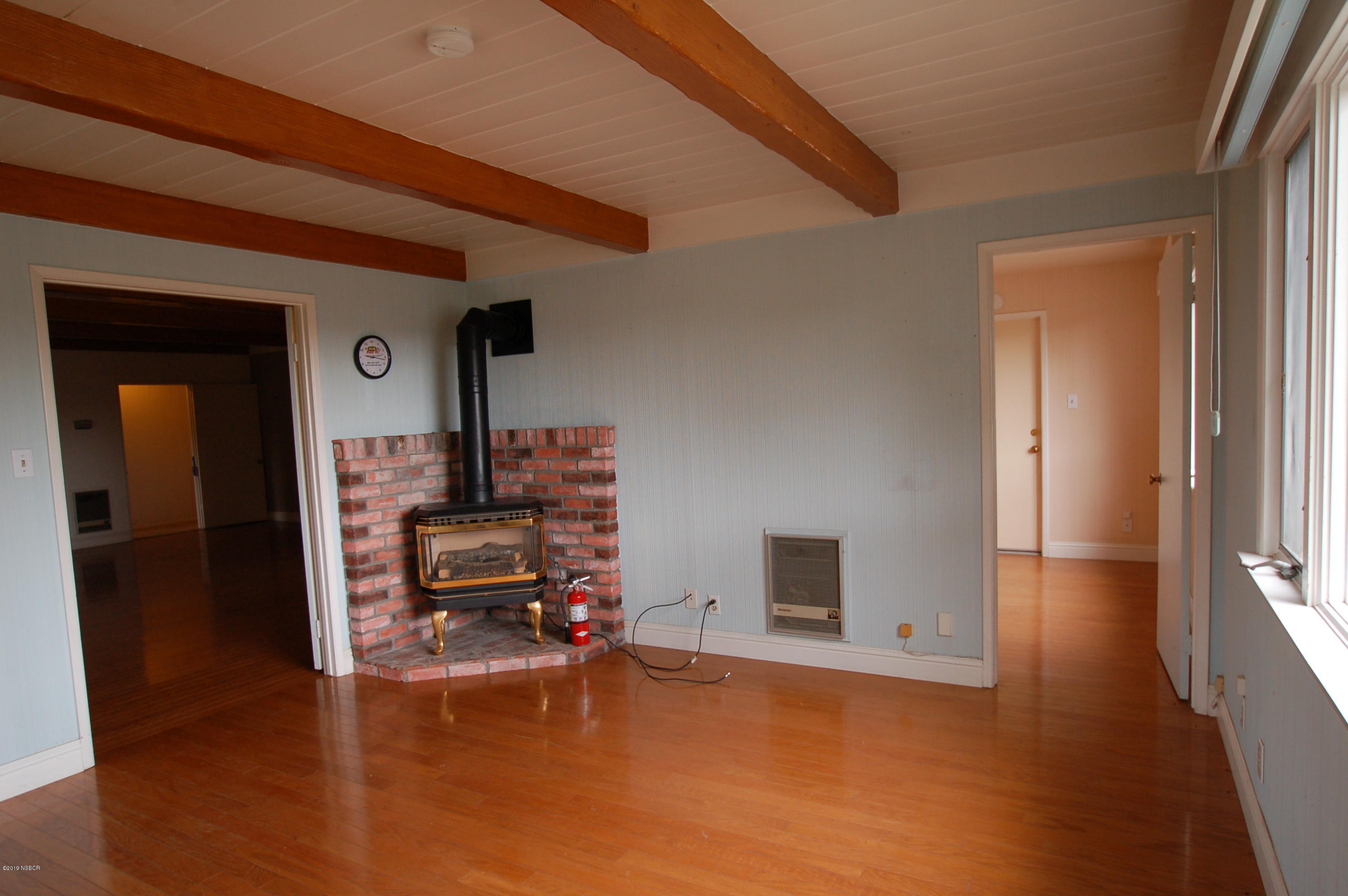 724 North Refugio Road Santa Ynez, CA 93460 - Photo 6 of 25 a living room with furniture and a fireplace