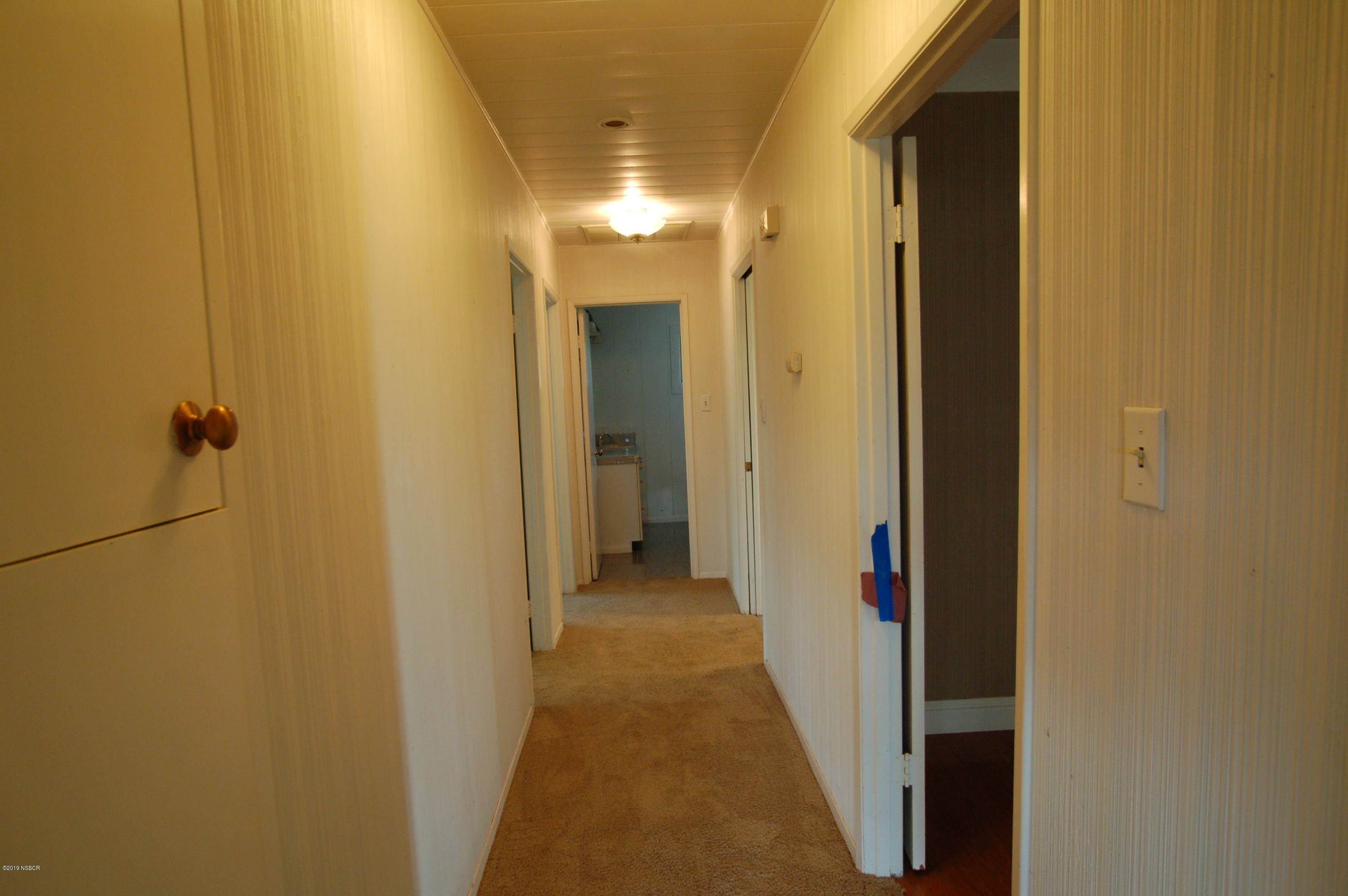 724 North Refugio Road Santa Ynez, CA 93460 - Photo 9 of 25 a view of a hallway with a yellow space