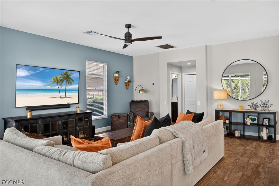 22866 Forest Ridge Drive Estero, FL 33928 - Photo 11 of 38 a living room with fireplace furniture and a flat screen tv