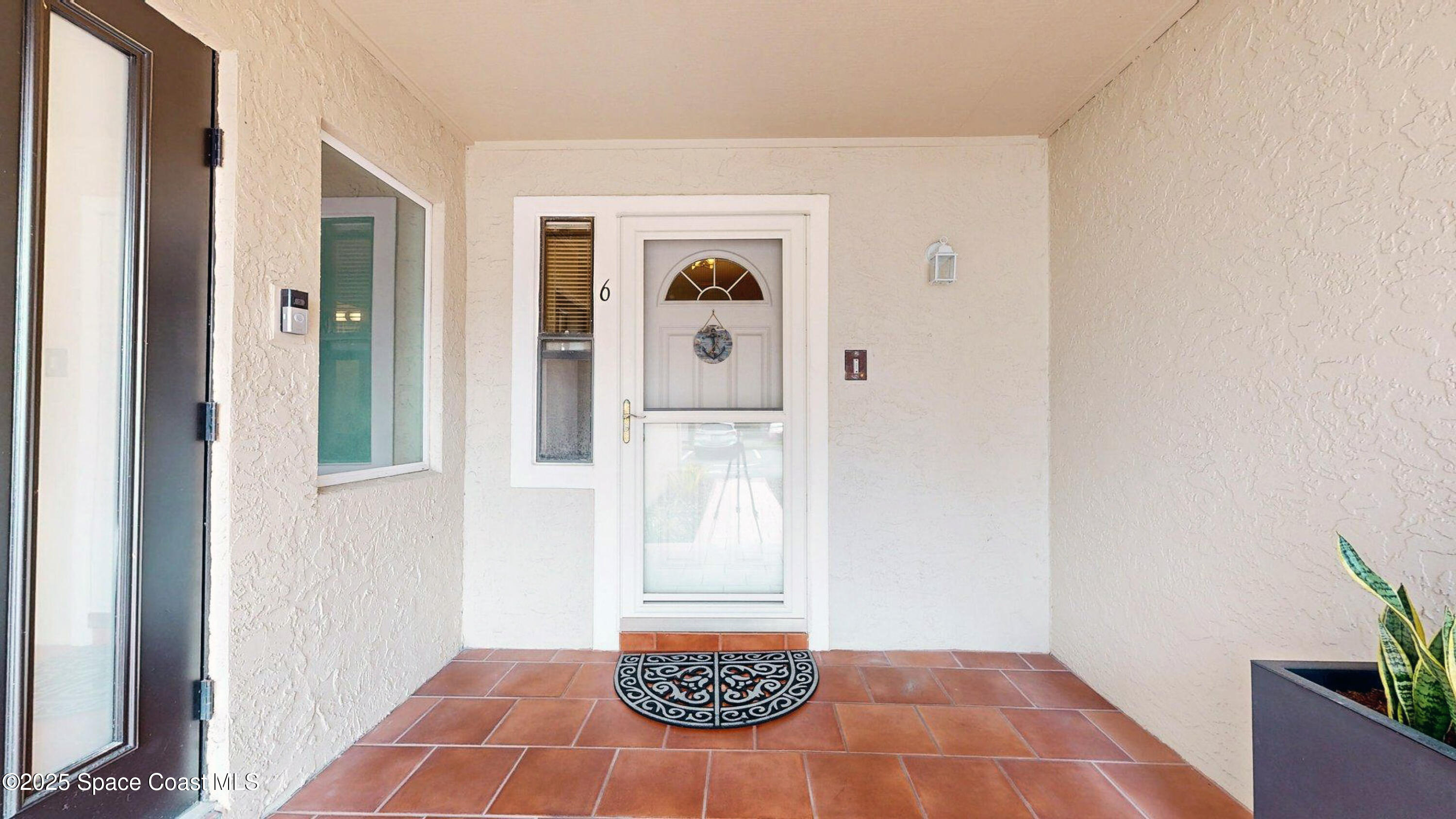 101 La Costa Street, Unit 6B Melbourne, FL 32951 - Photo 1 of 24 a bedroom with a bed and a window