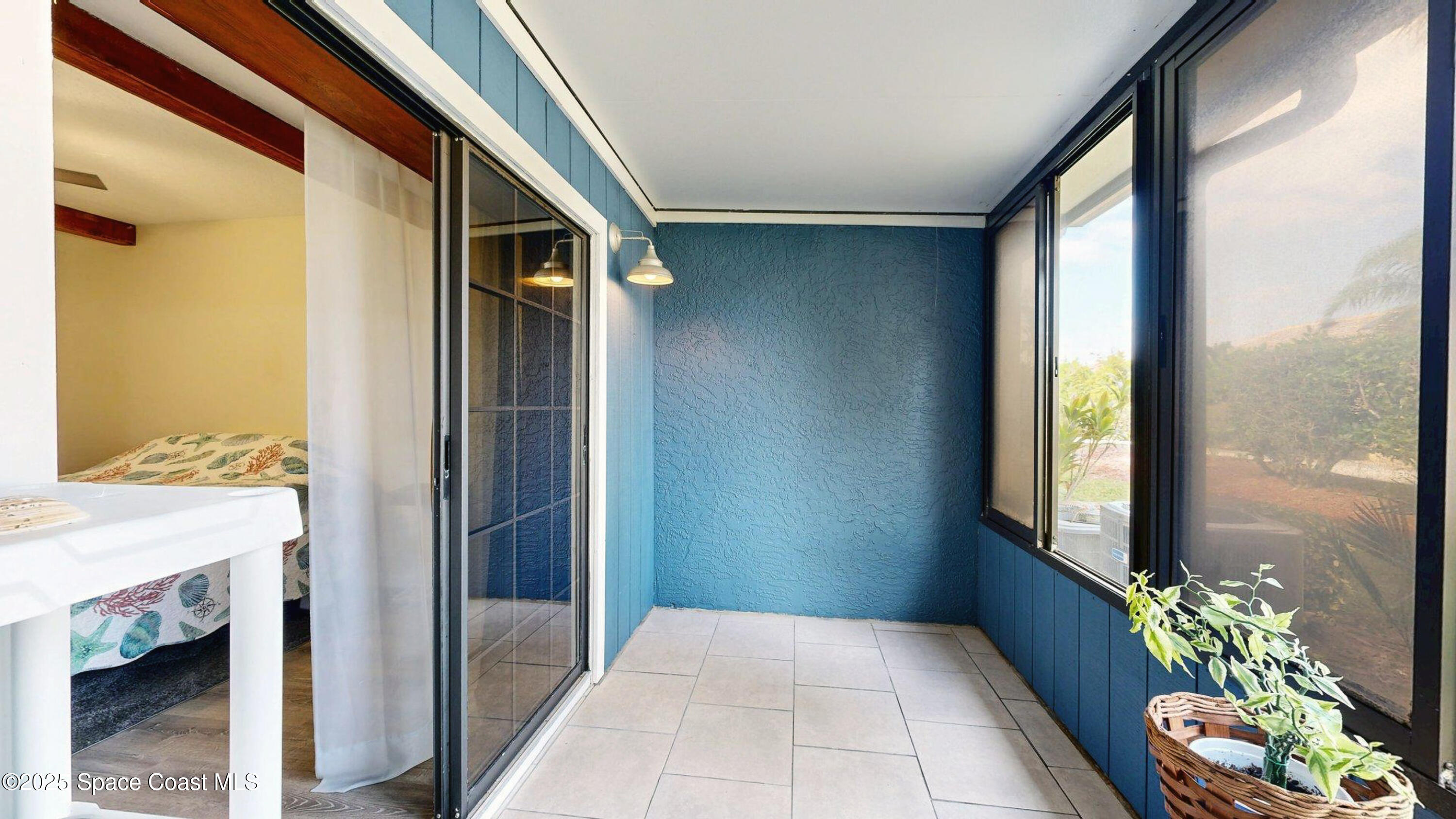 101 La Costa Street, Unit 6B Melbourne, FL 32951 - Photo 11 of 24 a view of an entryway and wooden floor