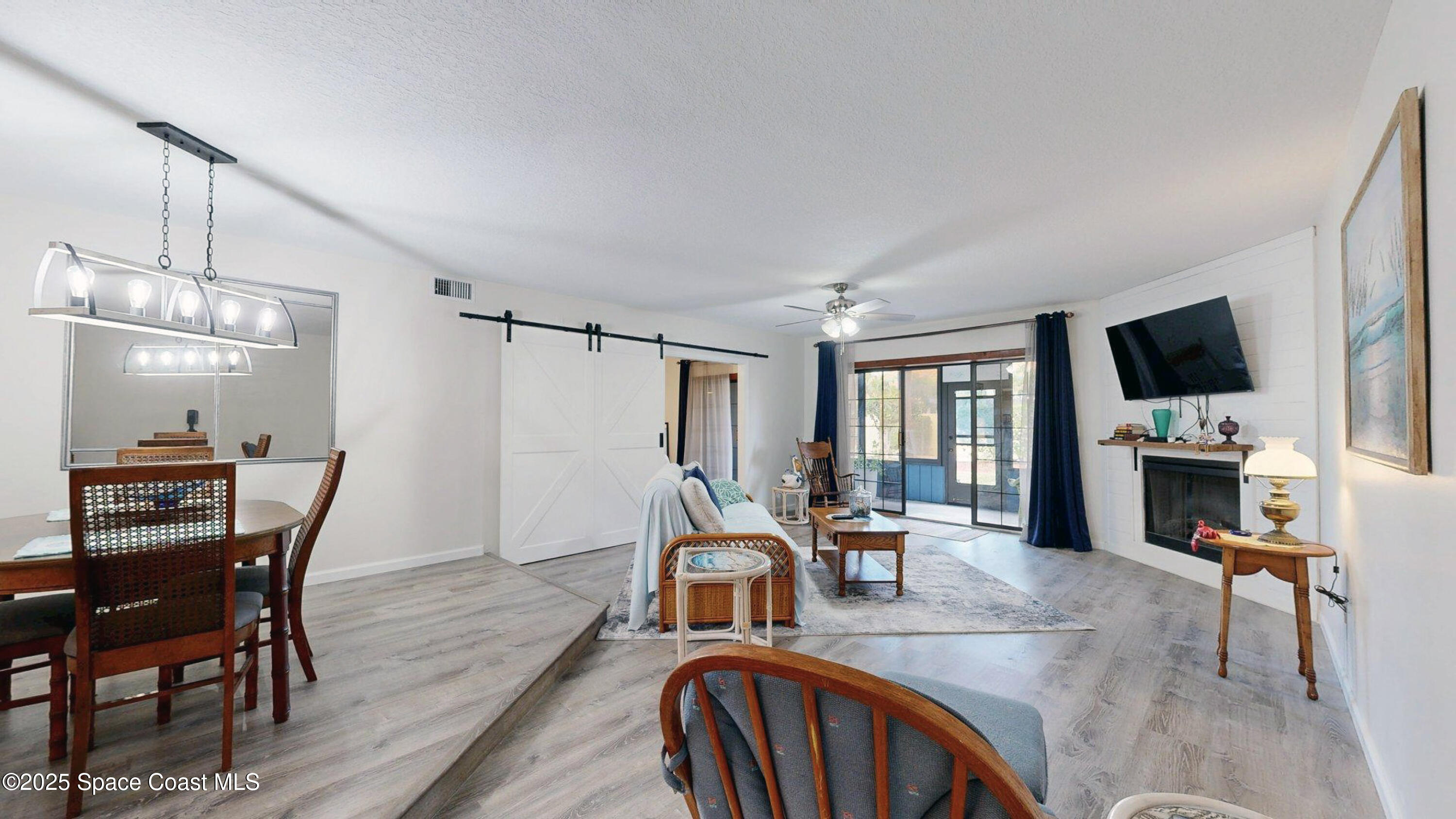 101 La Costa Street, Unit 6B Melbourne, FL 32951 - Photo 6 of 24 a view of a dining room with furniture window and wooden floor