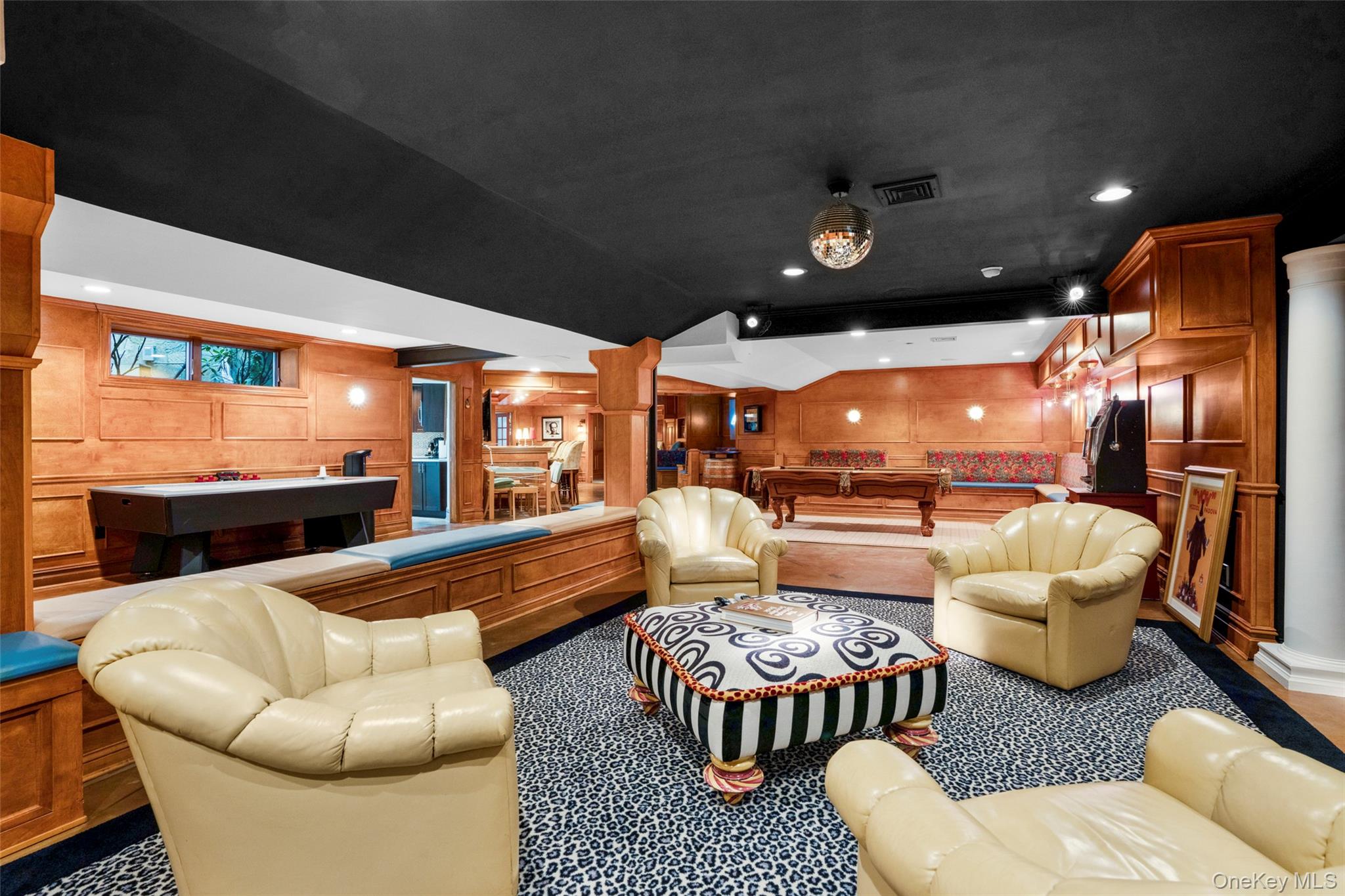 23 Pheasant Drive Rye, NY 10580 - Photo 22 of 35 Custom wood work throughout the many entertainment areas in the lower level...disco ball included!