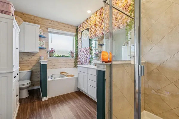 a bathroom with a toilet sink and mirror