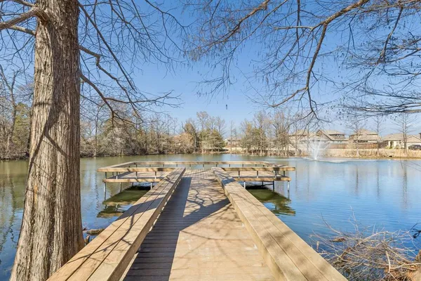 a view of a balcony with trees