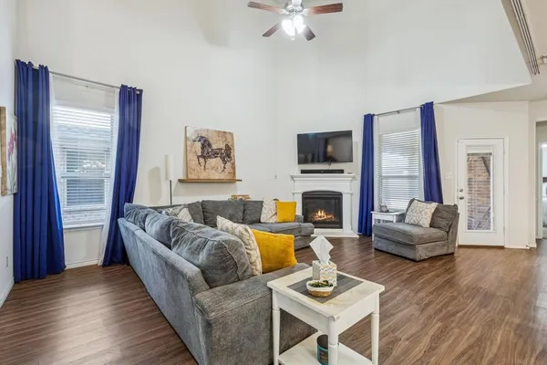 a living room with furniture fireplace and a flat screen tv