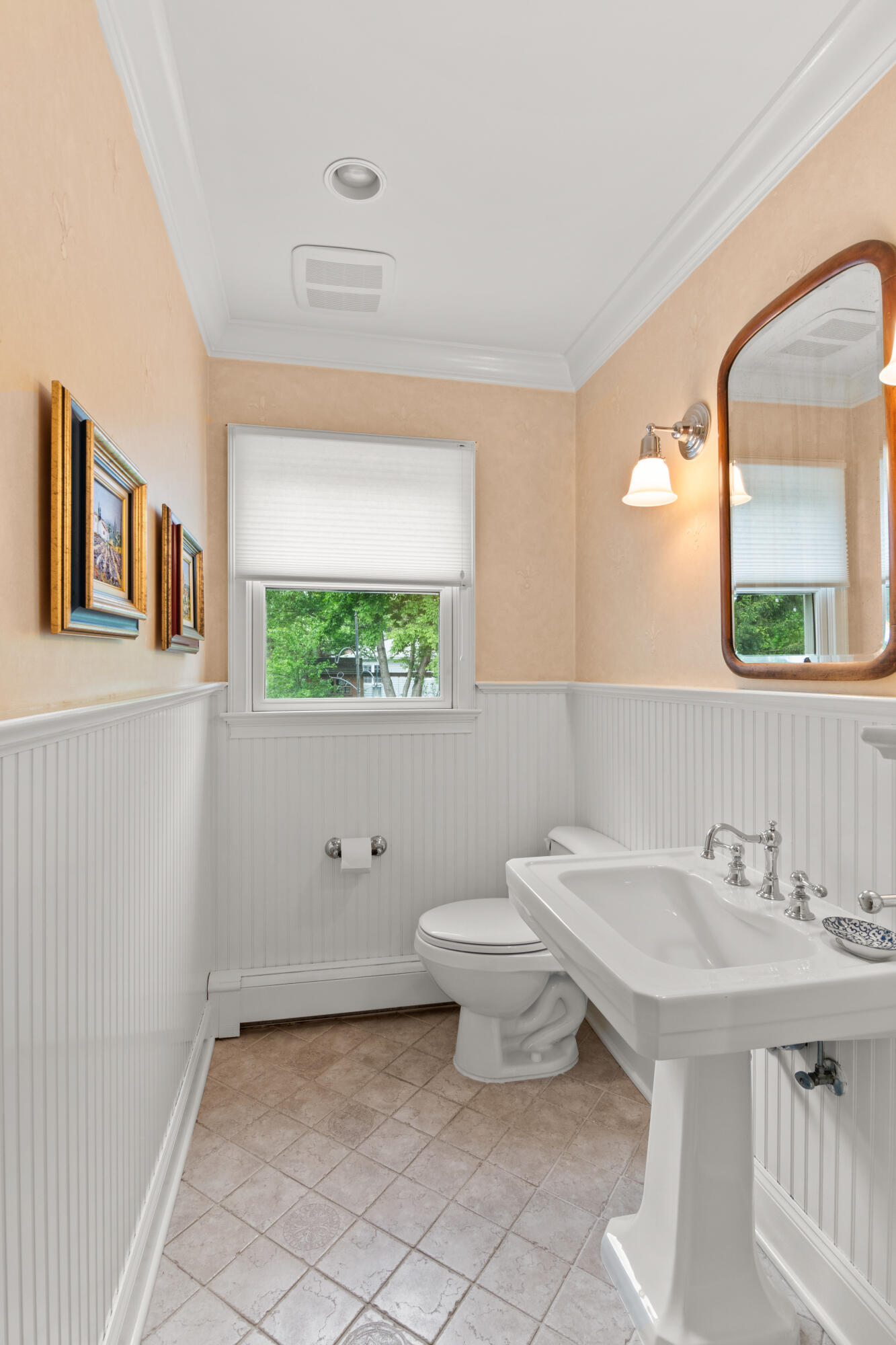 3 Old Field Road Rowayton, CT 06853 - Photo 12 of 29 a bathroom with a toilet a sink a mirror and a window