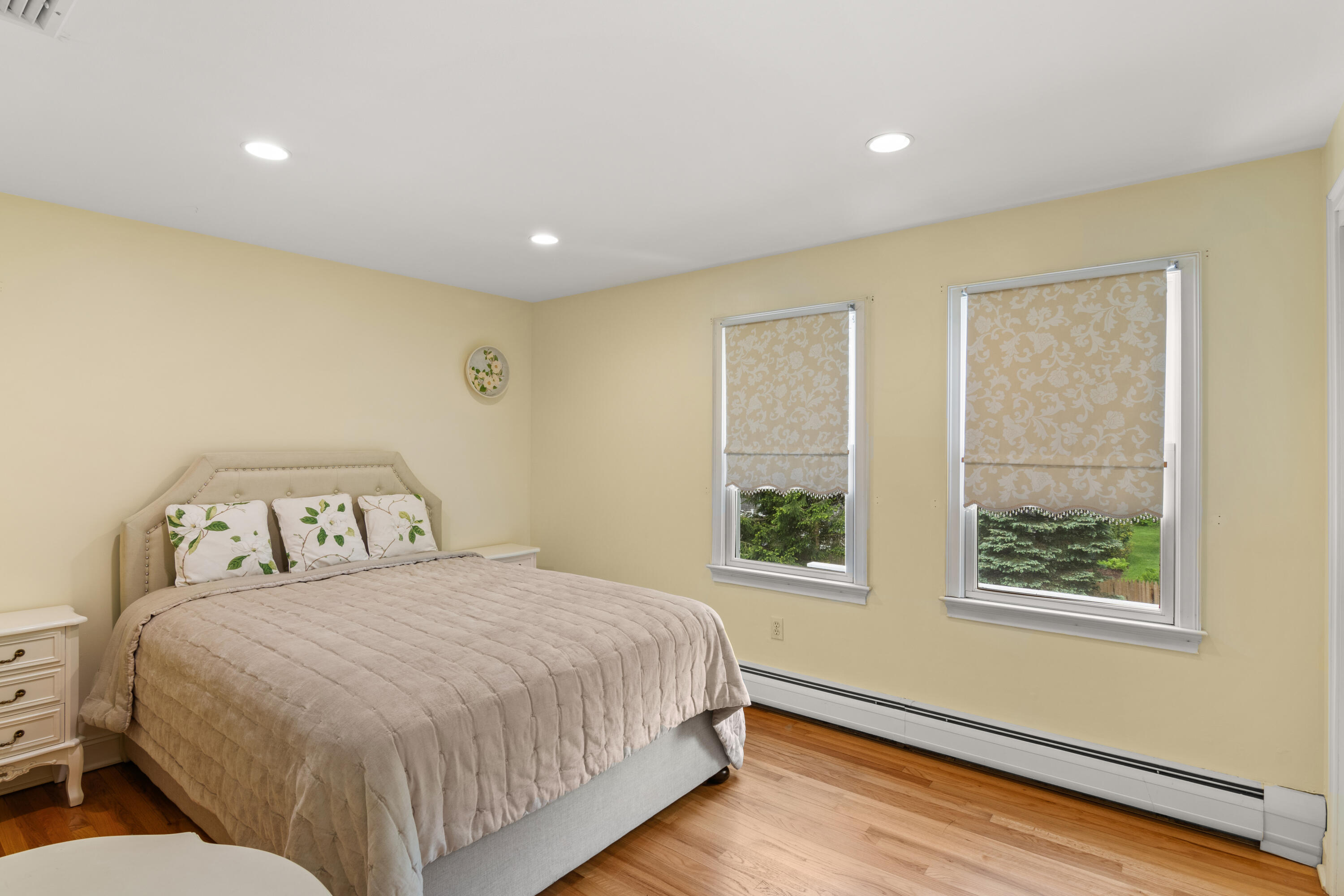 3 Old Field Road Rowayton, CT 06853 - Photo 19 of 29 a spacious bedroom with a bed and wooden floor