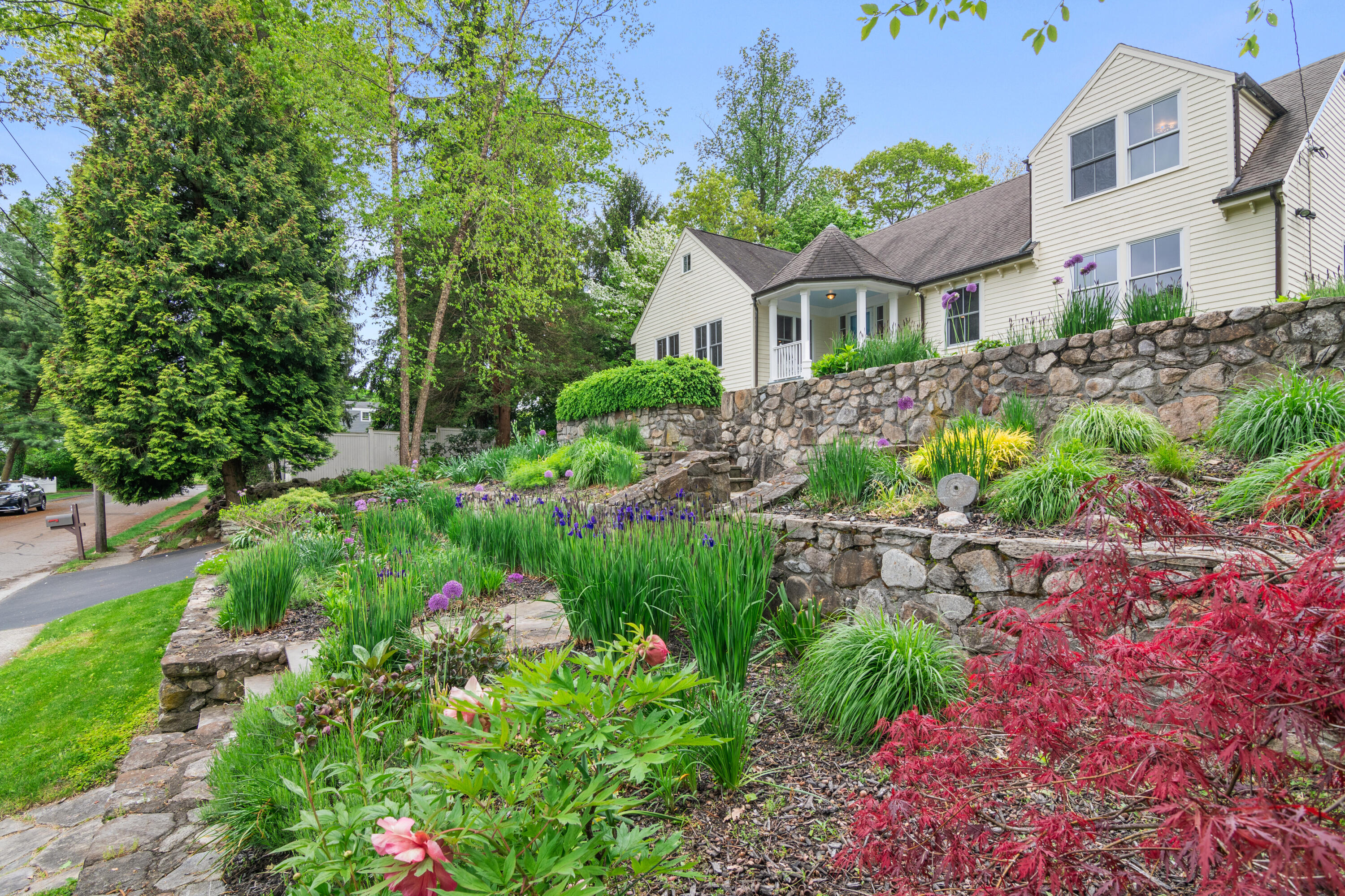 3 Old Field Road Rowayton, CT 06853 - Photo 2 of 29 a front view of a house with a yard and fountain