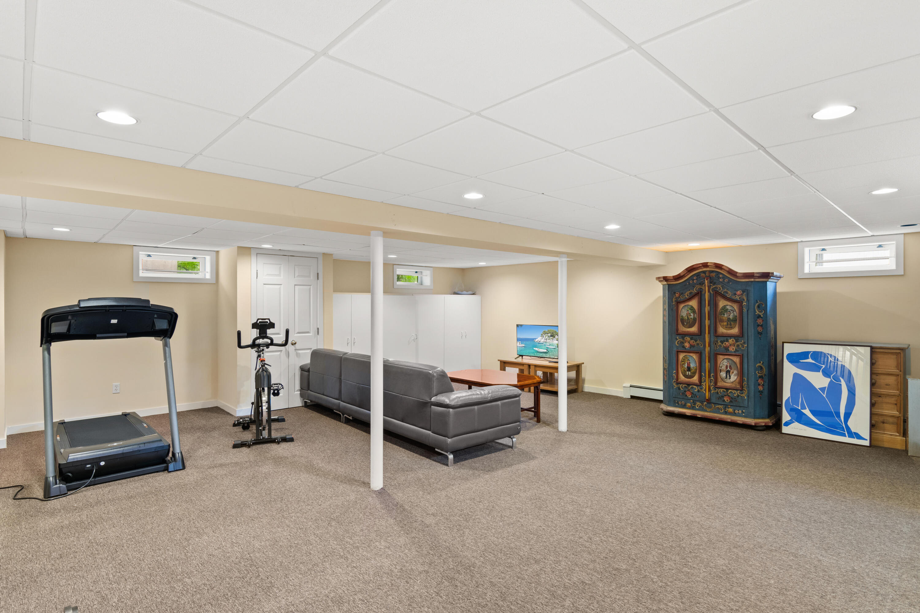 3 Old Field Road Rowayton, CT 06853 - Photo 22 of 29 a living room with furniture and gym equipment