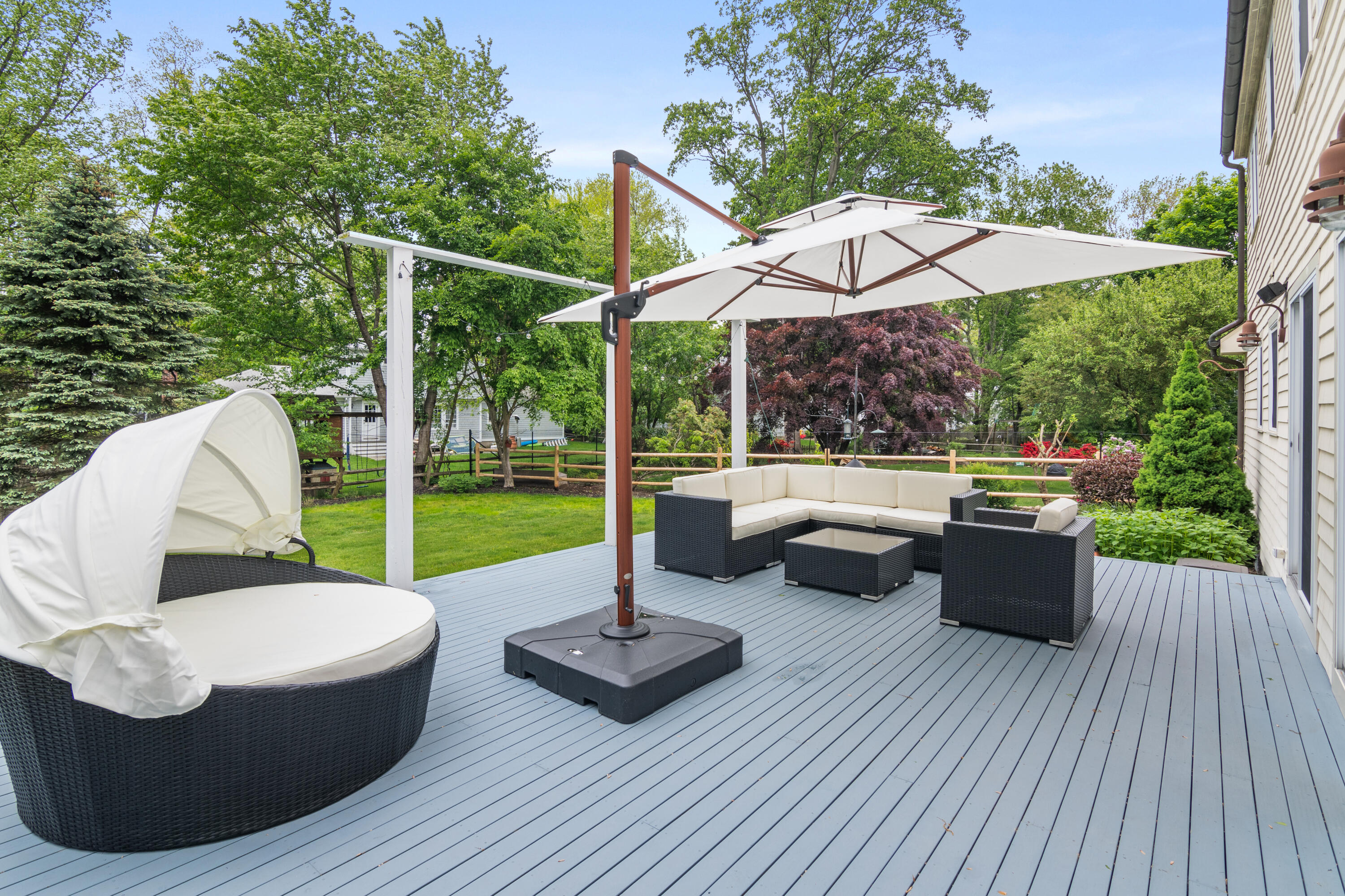3 Old Field Road Rowayton, CT 06853 - Photo 24 of 29 a view of a patio with couches potted plants and a patio