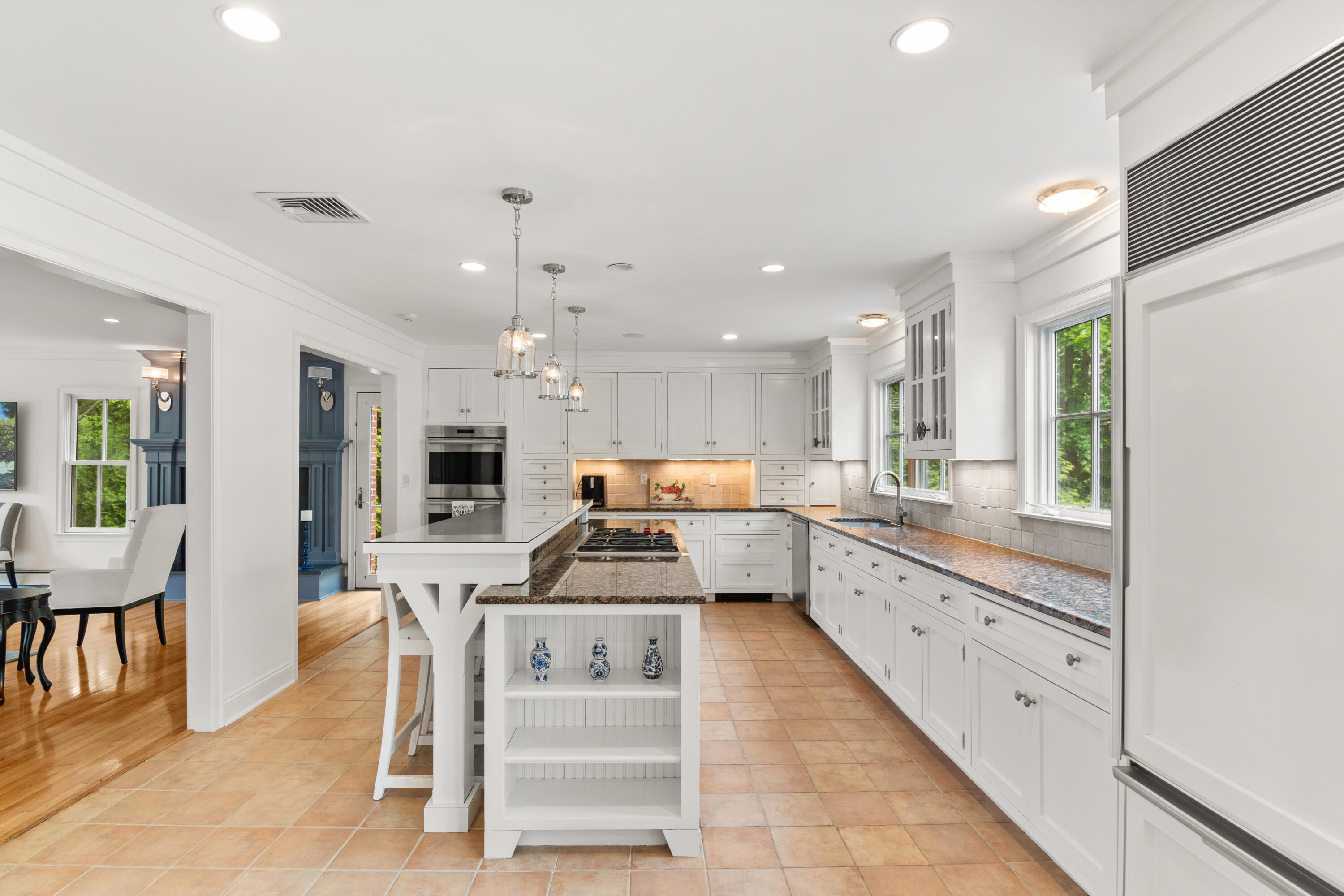 3 Old Field Road Rowayton, CT 06853 - Photo 7 of 29 a large kitchen with kitchen island a large counter top space a sink stainless steel appliances and cabinets