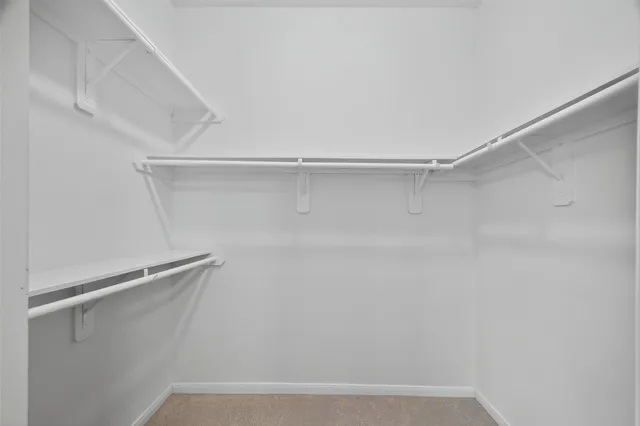 a view of an empty walk in closet