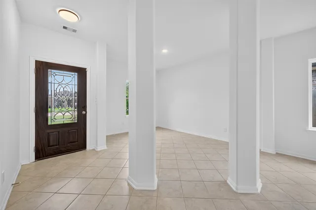 a view of hallway with a front door