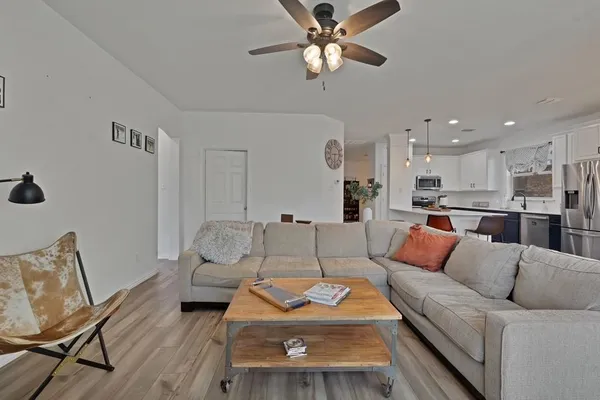 a living room with furniture and a table