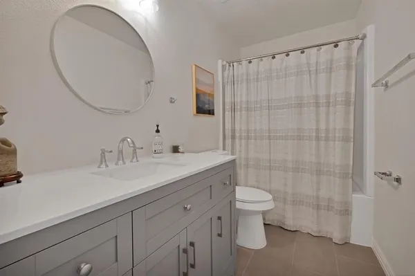 a room with window and ceiling fan